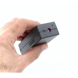 Car Security Camera with 25 Day Battery Backup held between fingers