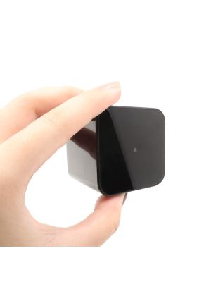 Wifi Safety AC Wall Charger Mini Home Security camera being hand held