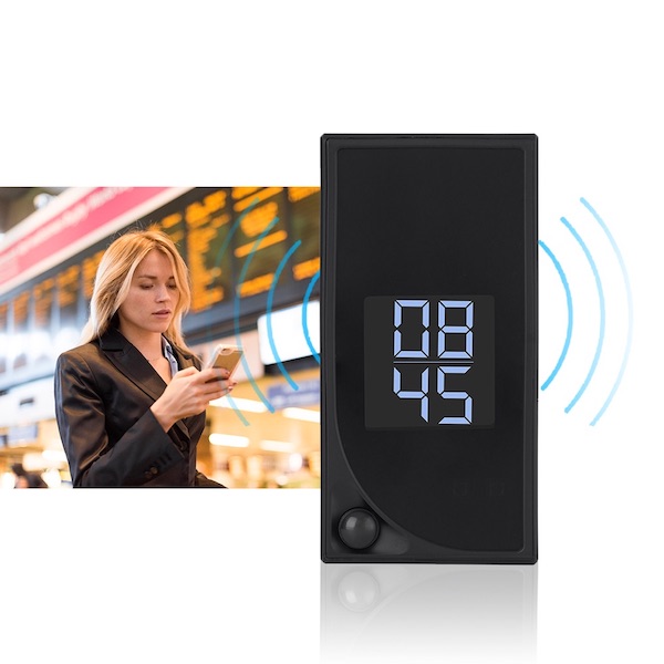 wifi clock pir spy camera showing a woman looking at a mobile phone live view