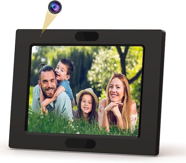Photo frame hidden camera and clock showing the pinhole lens and a family